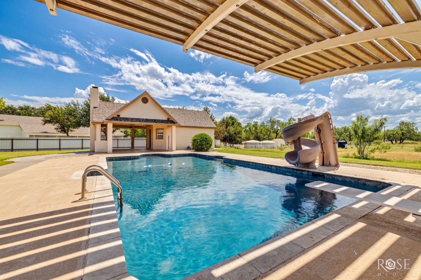 Backyard pool beside a cabana near Lake Nasworthy, San Angelo