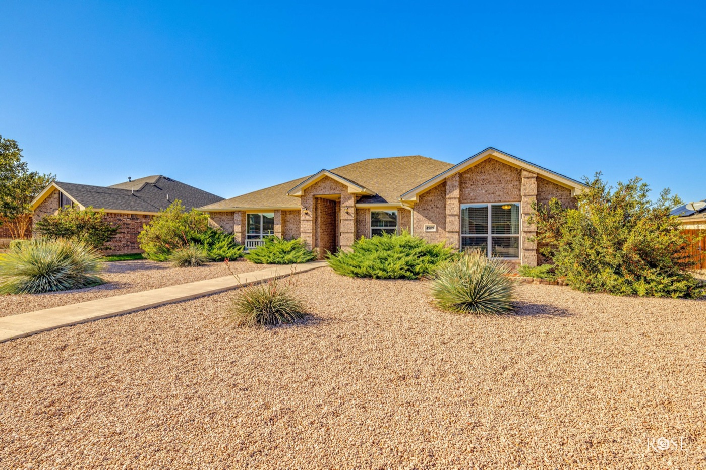 Brick home with xeriscape landscaping in San Angelo's Southland neighborhood